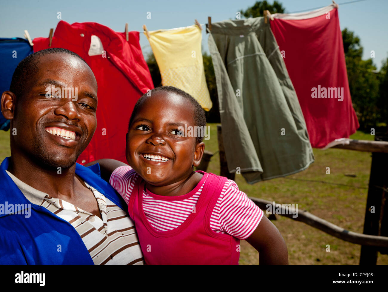 African father holding his daughter Stock Photo - Alamy