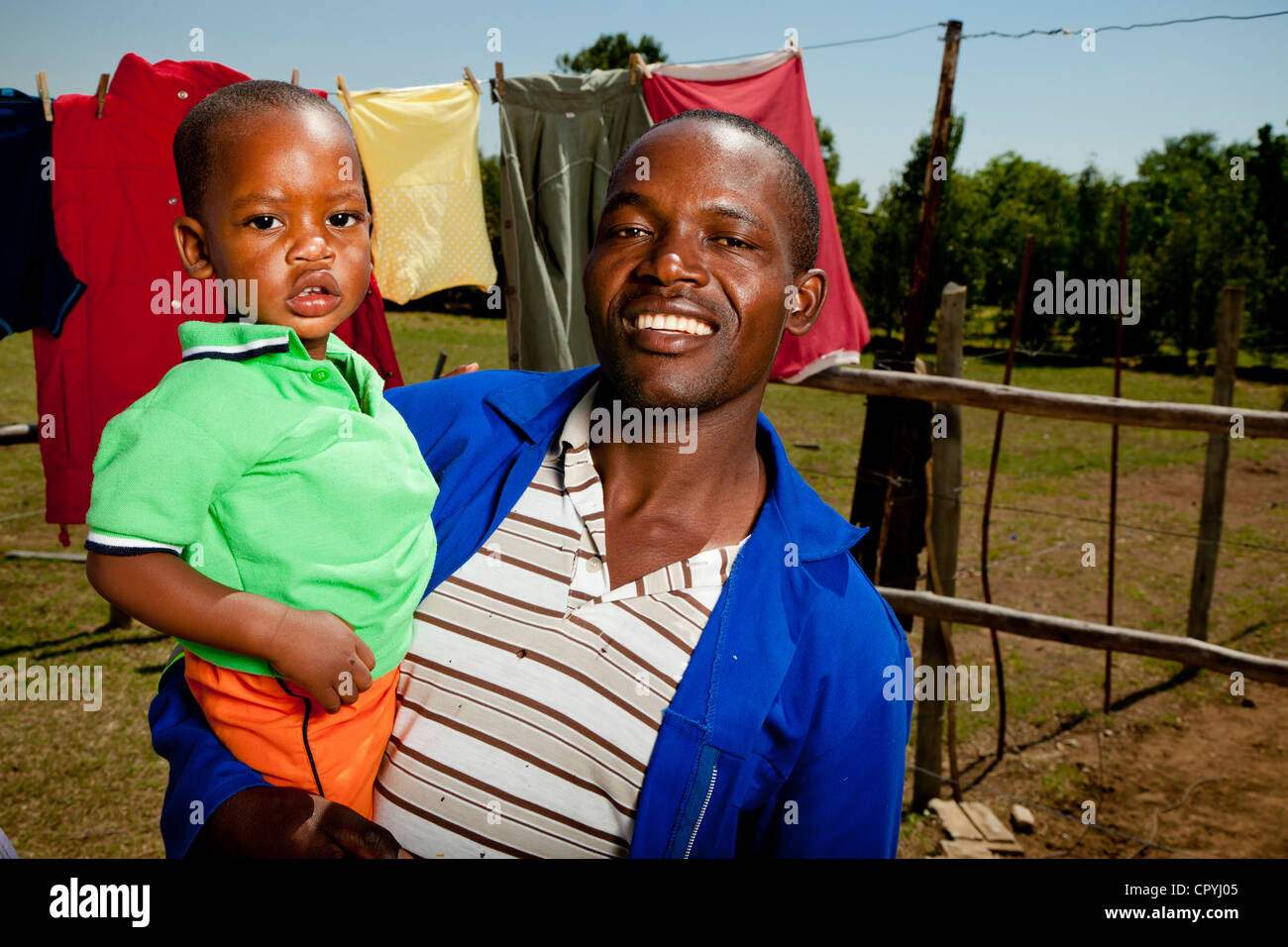 African father holding his son Stock Photo - Alamy