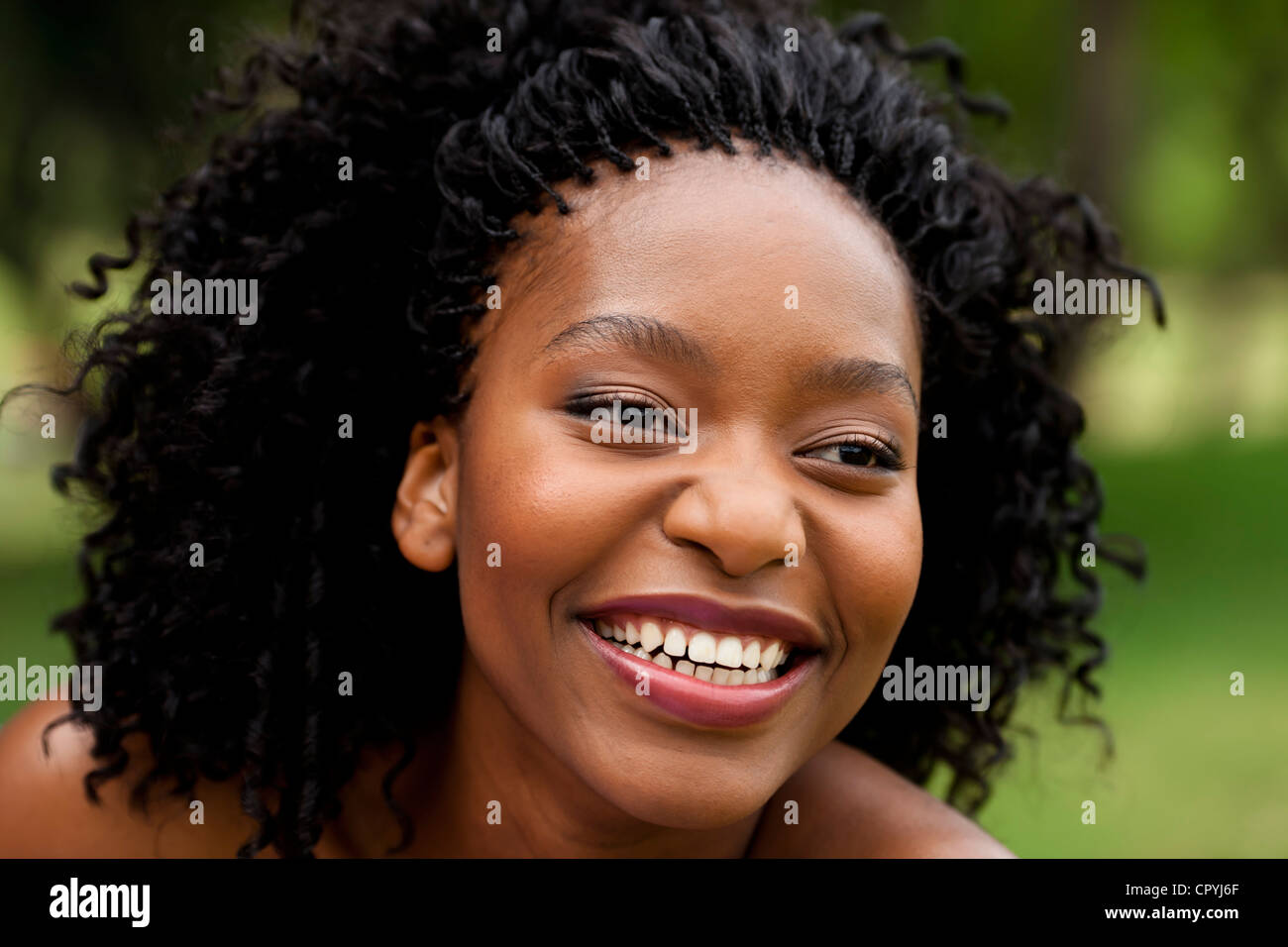 Closeup portrait of young black woman smiling Stock Photo - Alamy