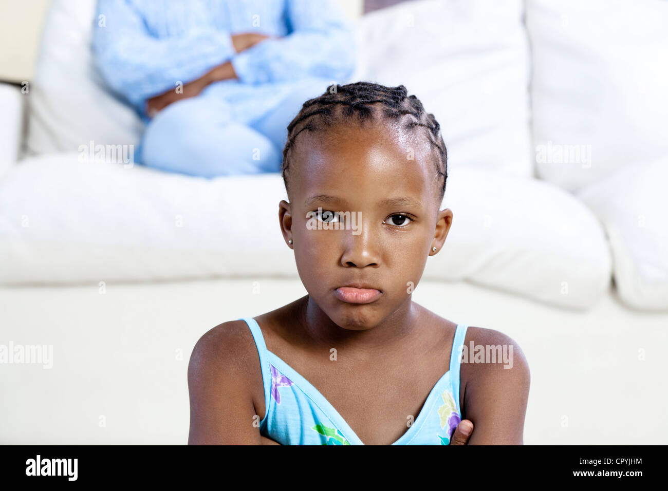 Closeup of young African girl frowning Stock Photo