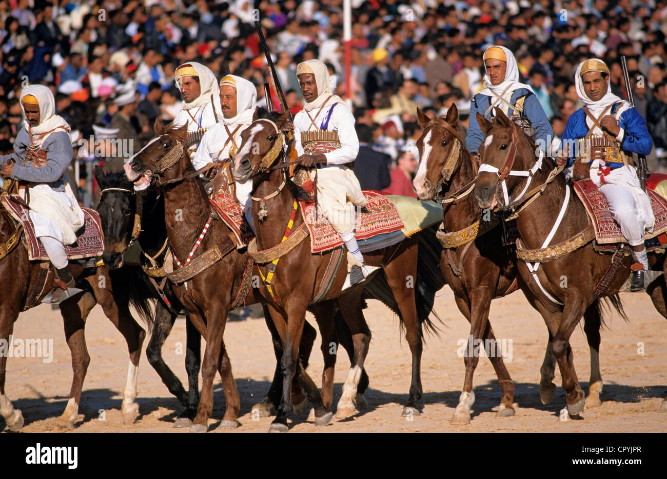 Tunisia, Kebili Governorate, Douz, Desert Festival, parade of the riders before the fantasia Stock Photo