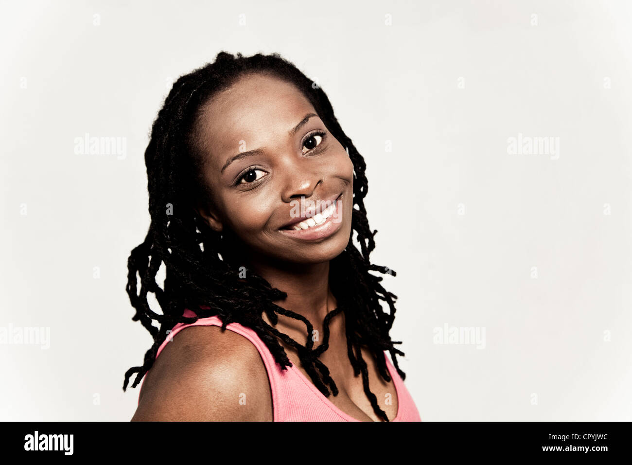 Head and shoulders portrait of young black woman Stock Photo - Alamy