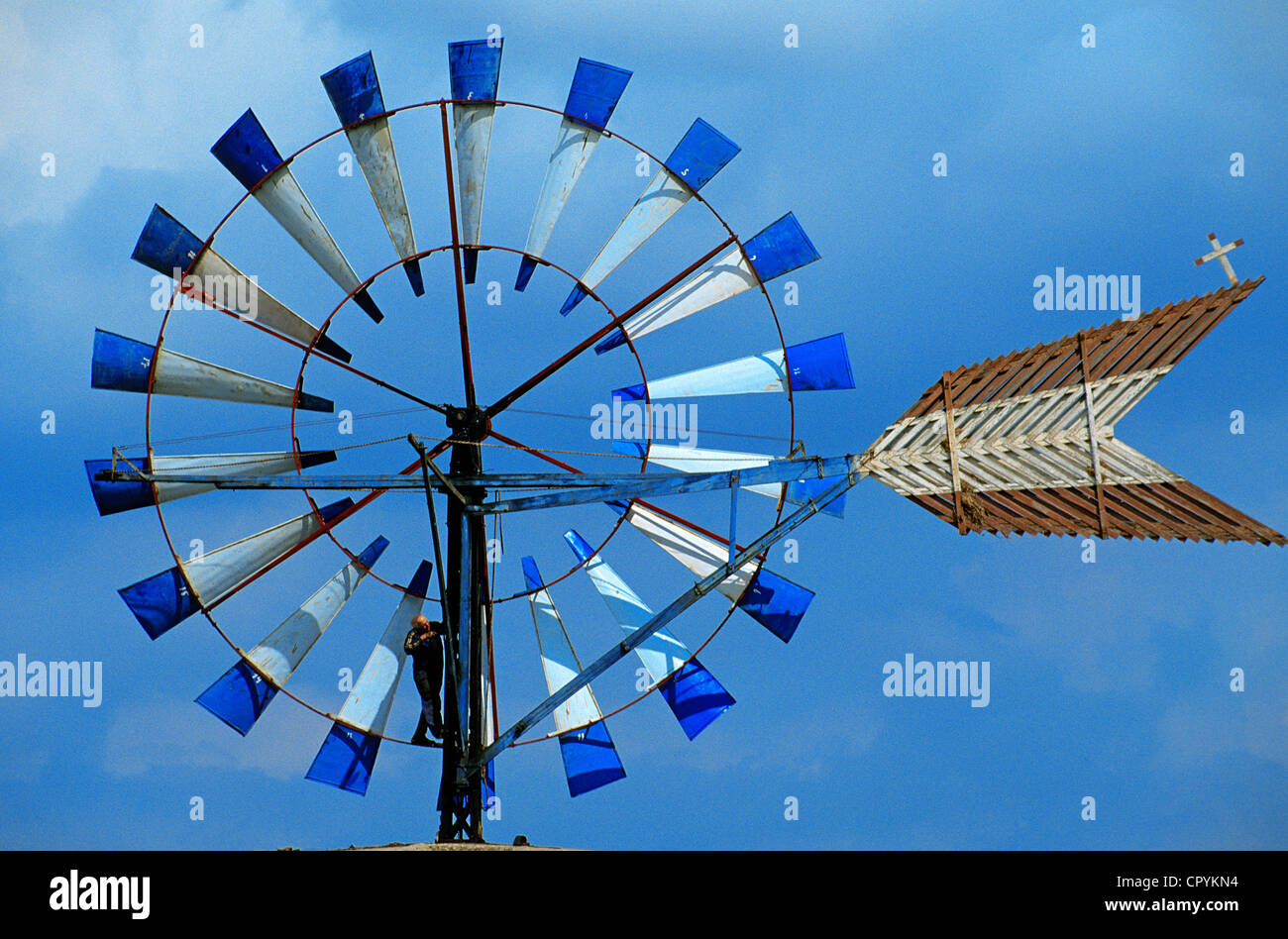 Spain, Balearic Islands, Majorca, mechanic verifying the mechanism wind turbine nearby Sa Pobla Stock Photo