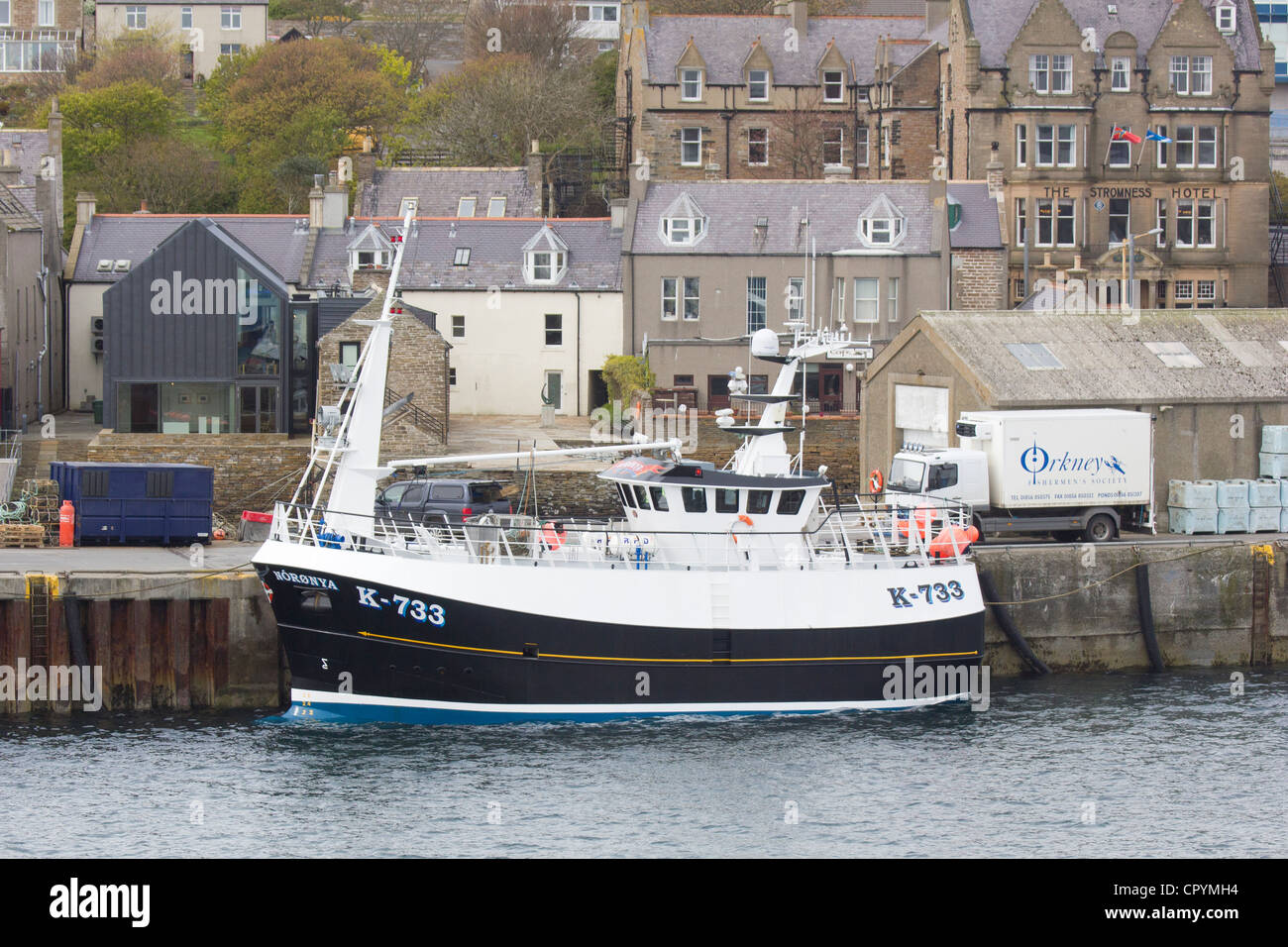 Stromness Harbour, Orkney Island and fishing boat Stock Photo