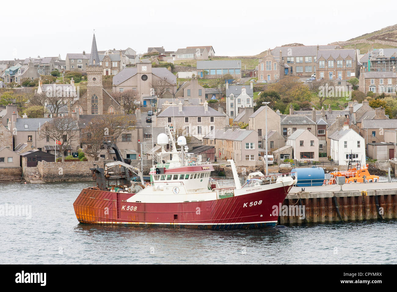 Stromness Harbour, Orkney Island and fishing boat Stock Photo