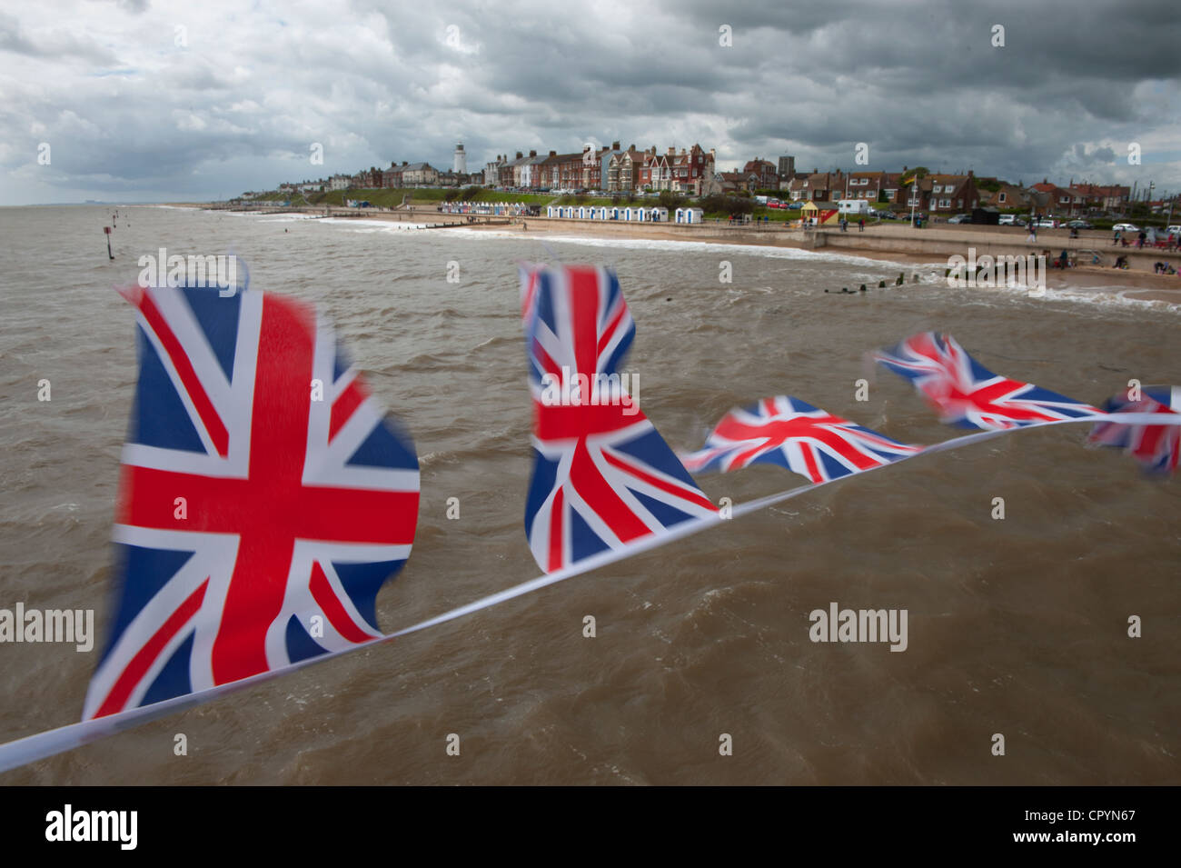 Southwold Beach and Union Jack Flags viewed from the Pier, Southwold, Suffolk, England, UK. 4-June-2012 Union Jack flags flutter Stock Photo