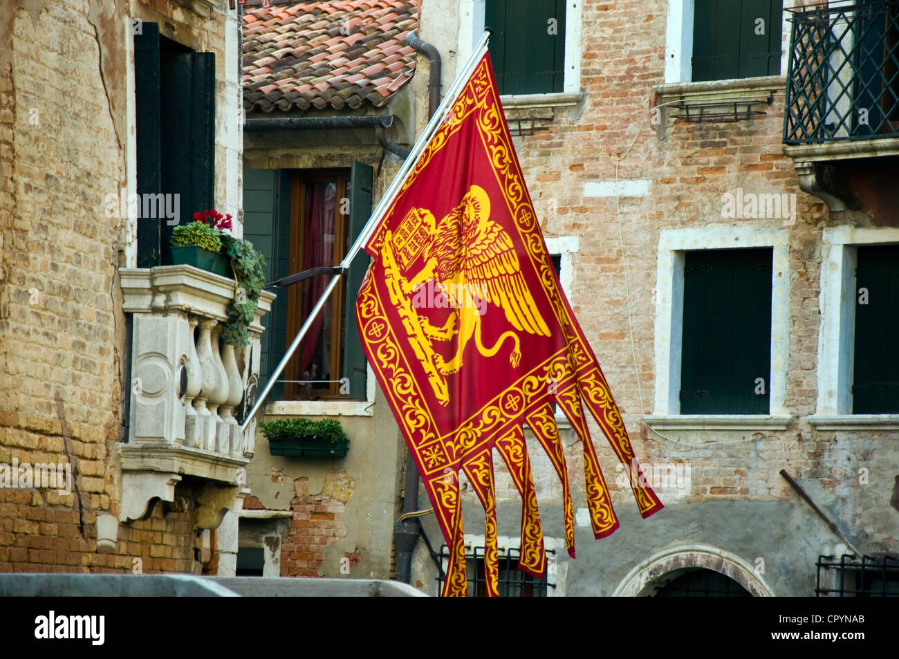 Flag of Venice Venetian flags showing the winged Lion of St. Mark Stock Photo