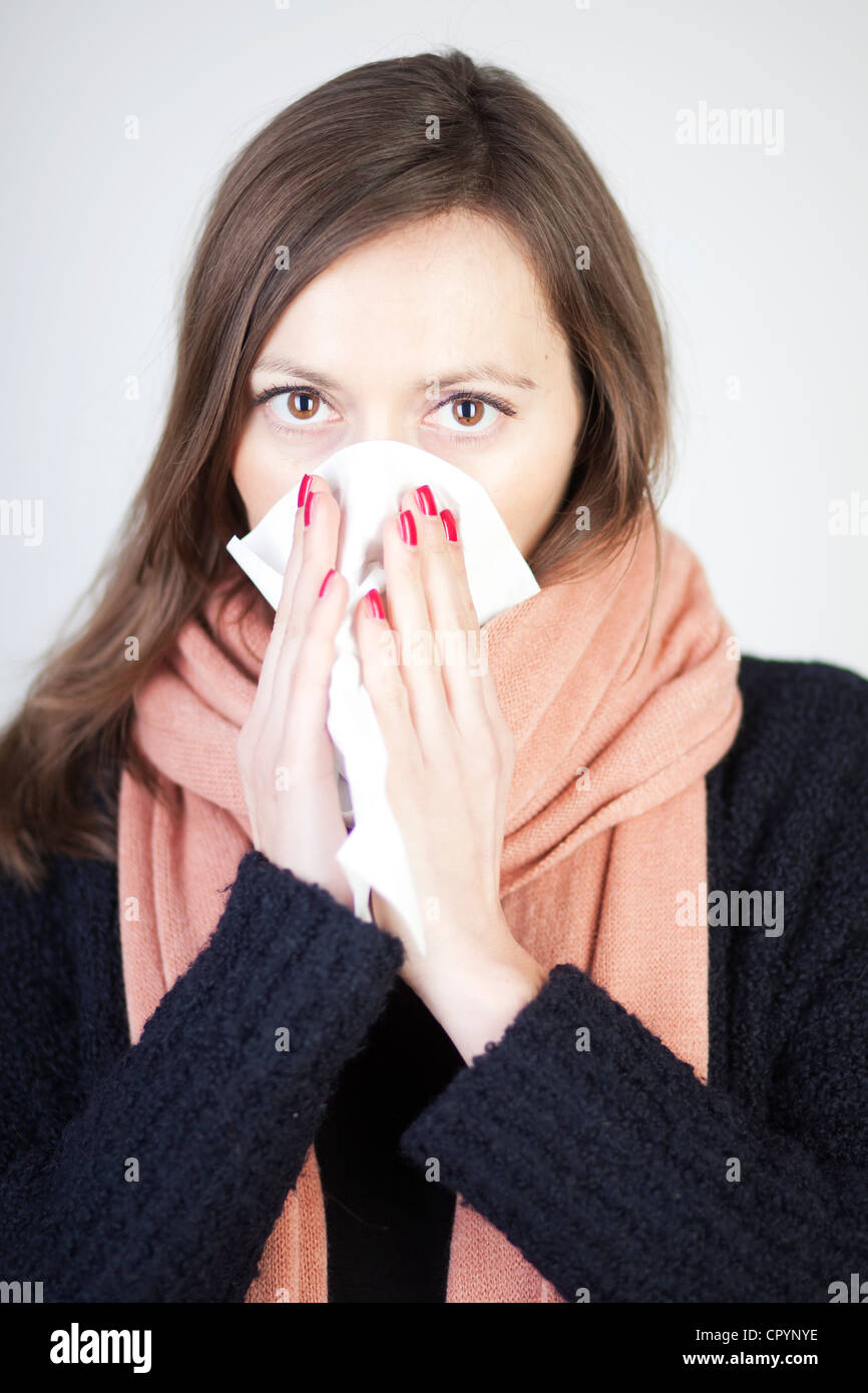 Woman blowing her nose with a handkerchief Stock Photo Alamy
