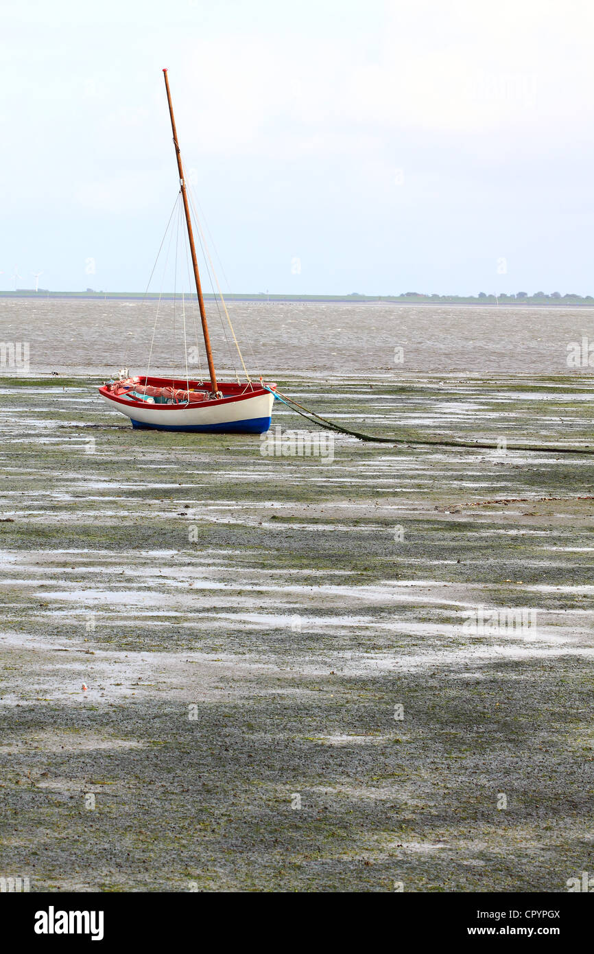 Mudflats at low tide with a sailing boat, Hallig Hooge, Northern Friesland, North Sea, Wadden Sea, Schleswig-Holstein Stock Photo