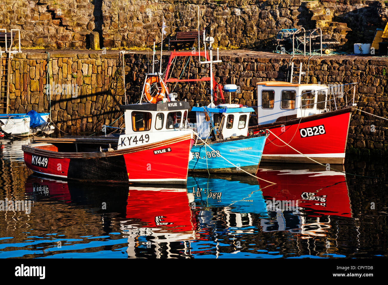 Fishing boats moored at Crail harbour, East Neuk of Fife, Scotland. Stock Photo