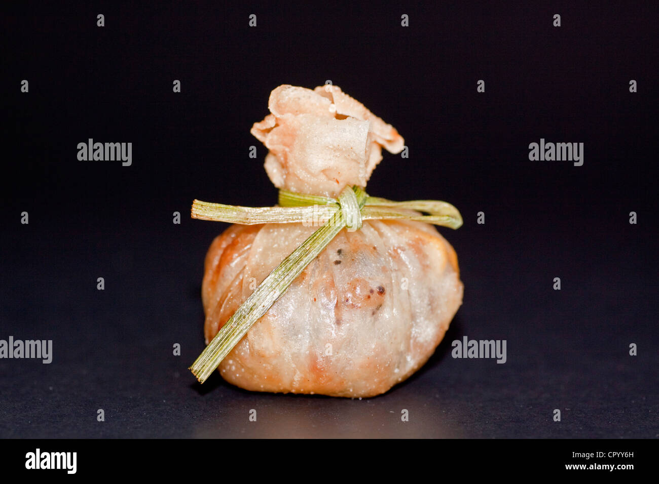Thai Money Bag starter, pastry filled with minced meat, rice and vegetables Stock Photo