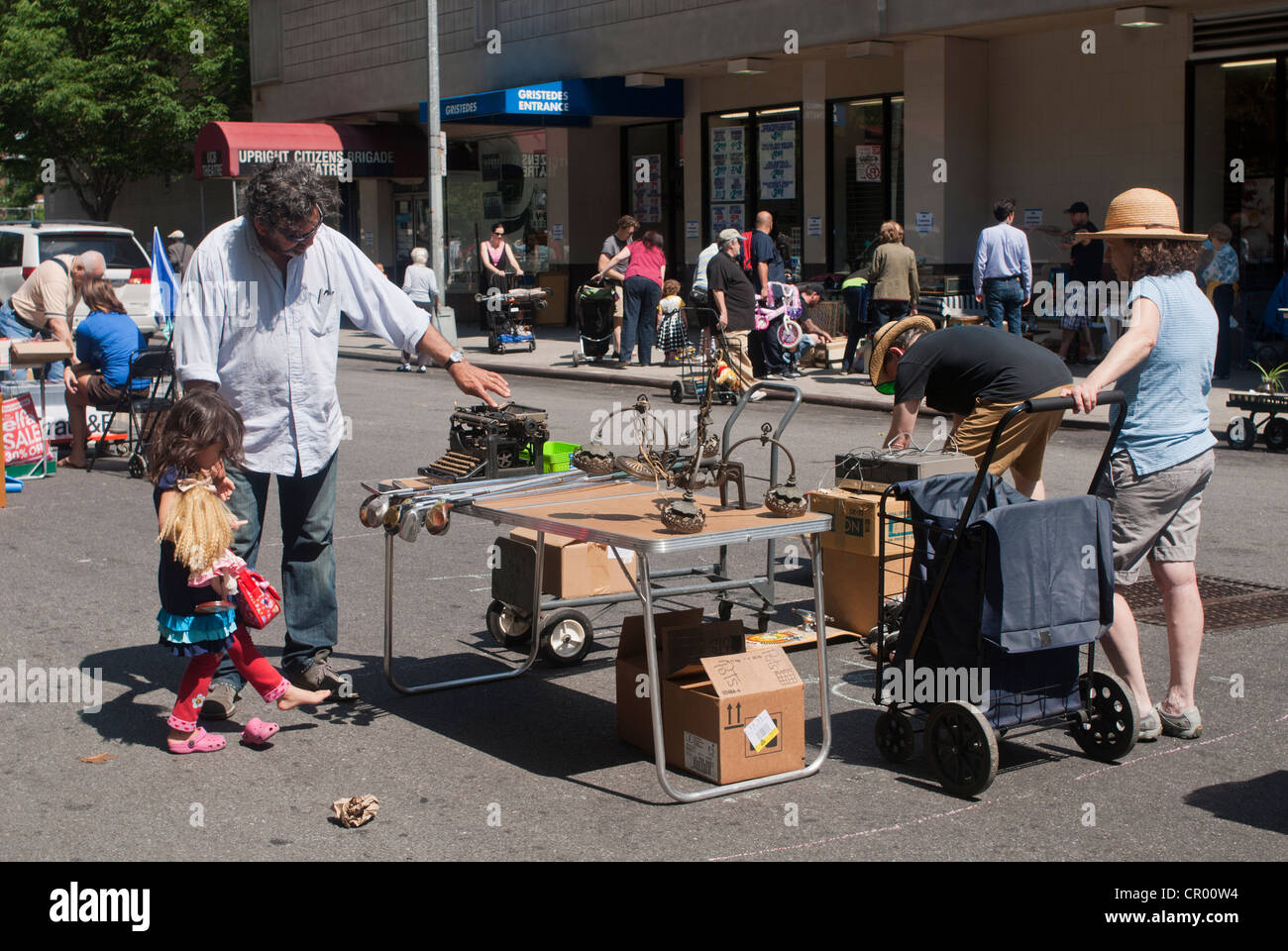 Shoppers search for bargains at the humongous Penn South Flea Market in the New York neighborhood of Chelsea Stock Photo