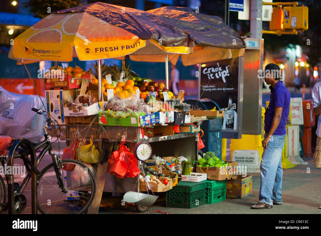 A 24 hour fruit and vegetable stand in the Chelsea neighborhood of New