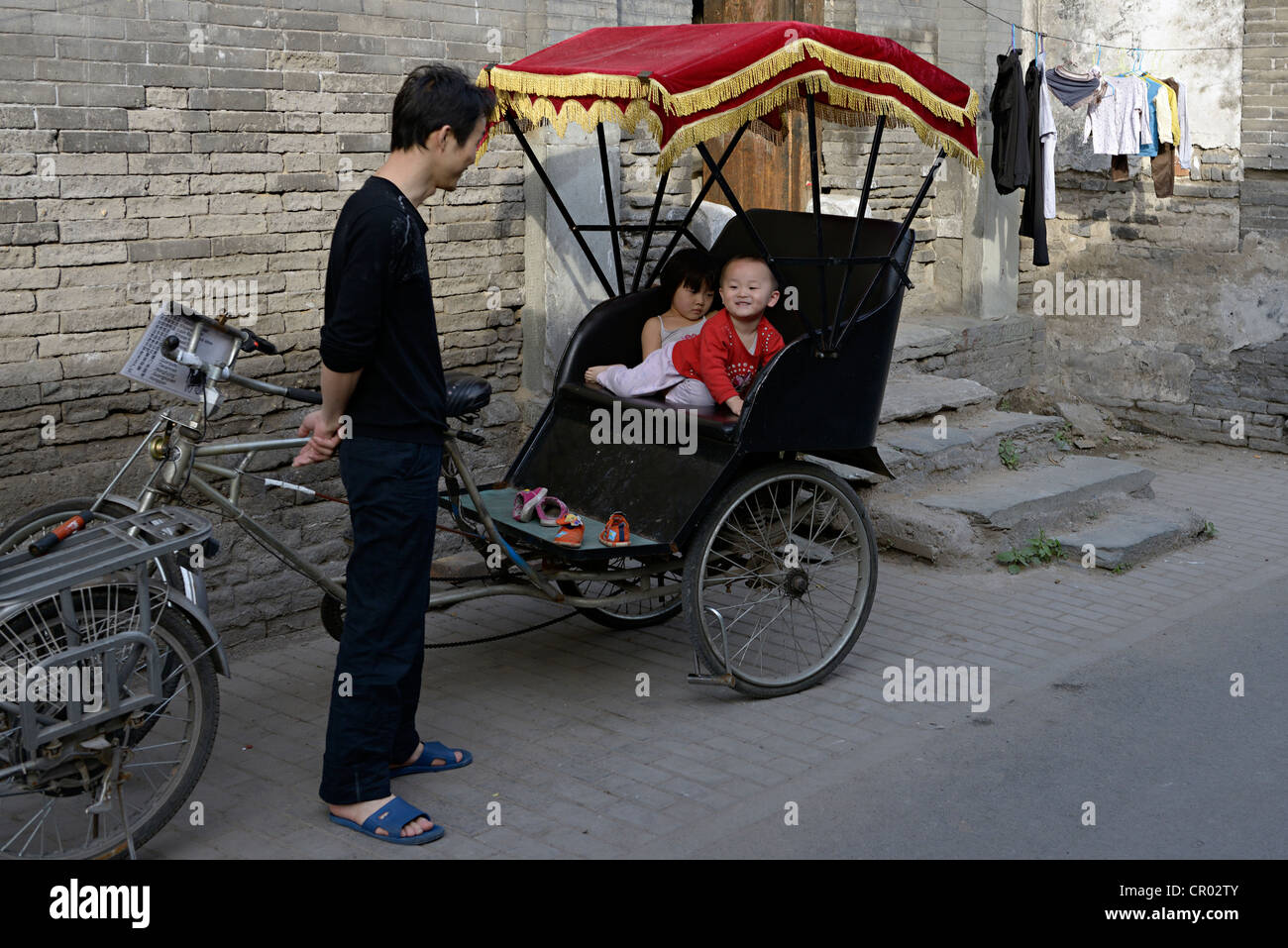 rickshaw children beijing china Stock Photo