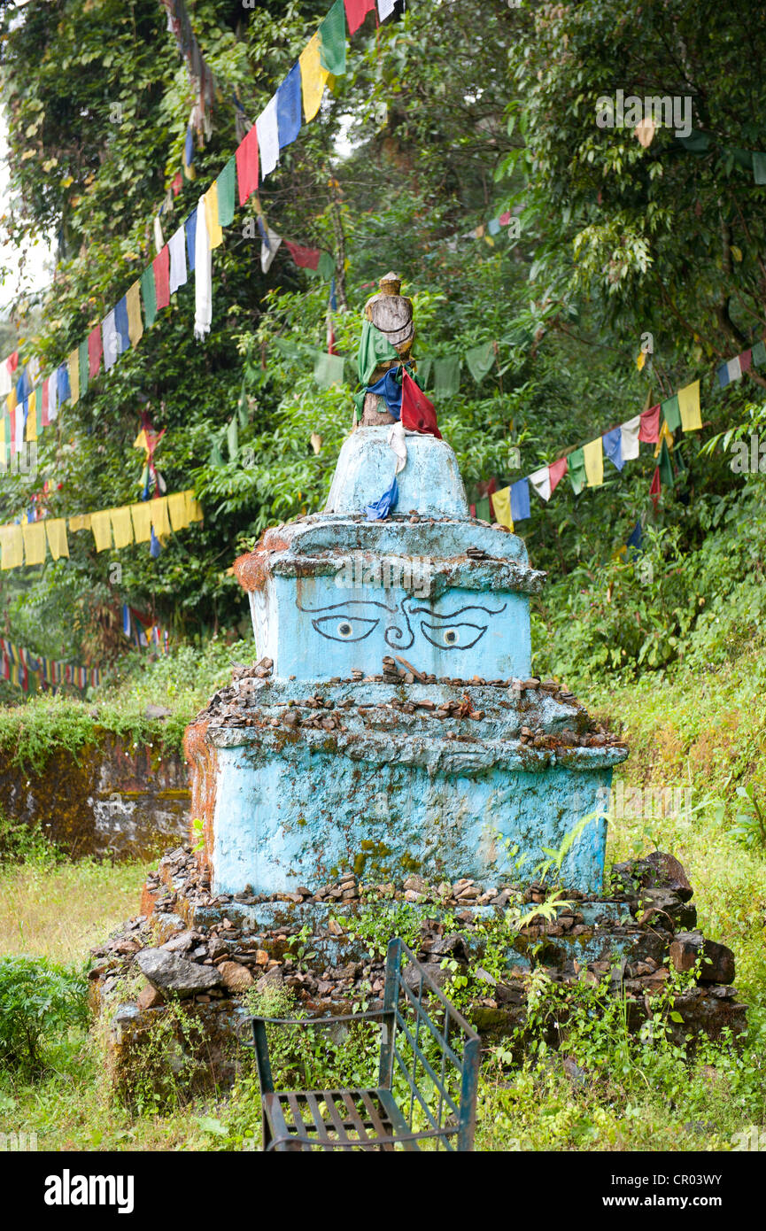 Simple light blue stupa, chorten, with painted eyes of Buddha, Khecheopalri Lake near Pelling, the Himalayas, Sikkim, India Stock Photo