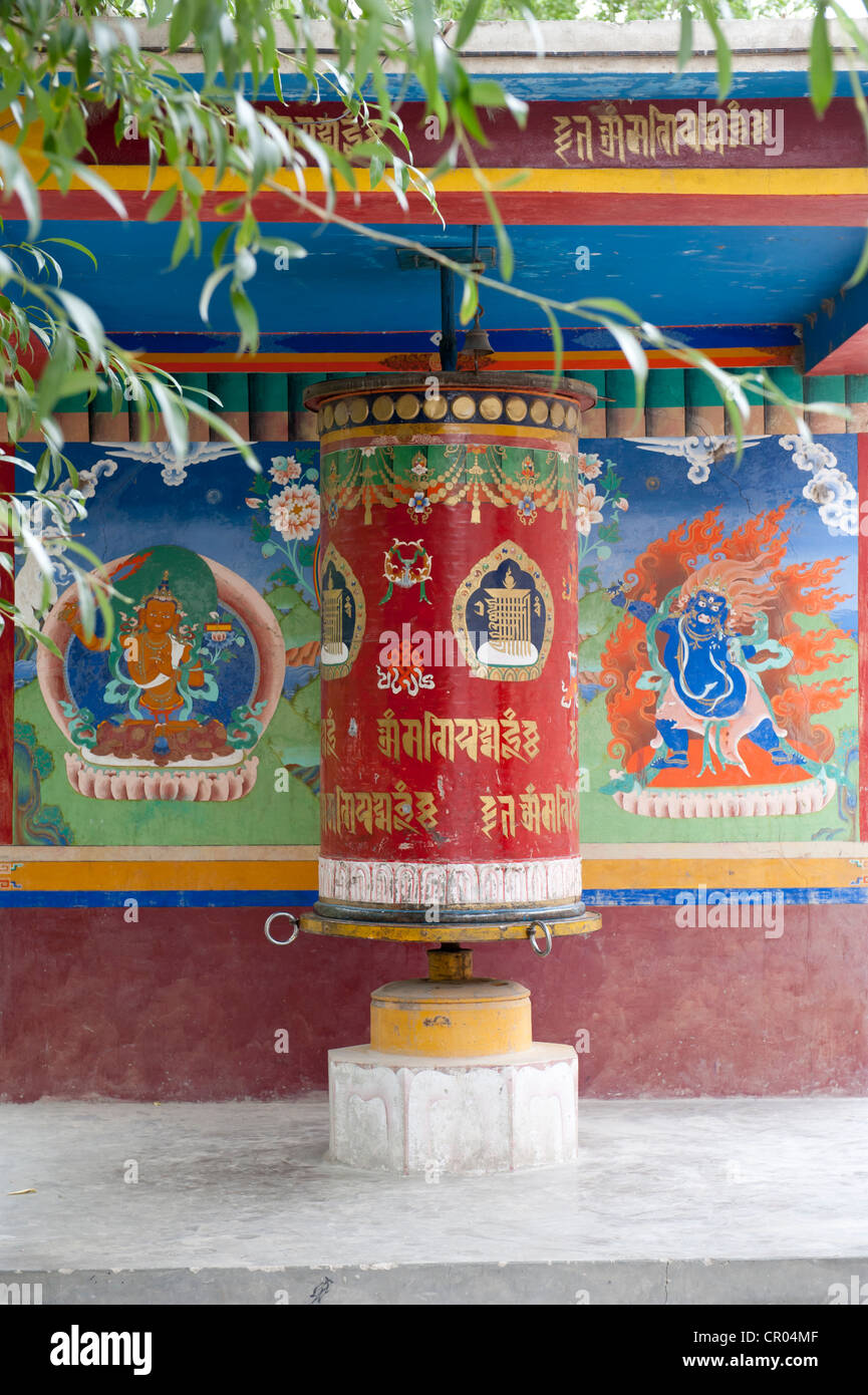 Tibetan Buddhism, large colorful prayer wheel, mural paintings, below the Spituk Monastery near