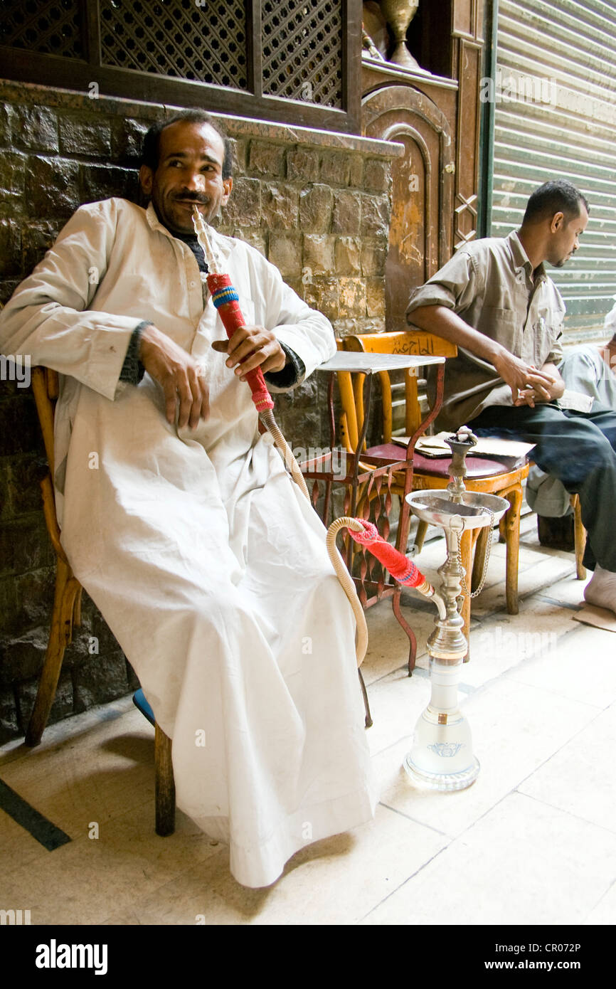 Egypt, Cairo, Khan El Khalili Souk, Chaouri smokes hookah in a cafe Stock Photo