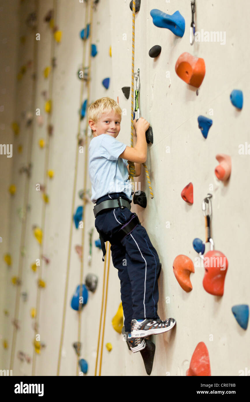 Boy, 7, climbing training on a climbing wall Stock Photo Alamy