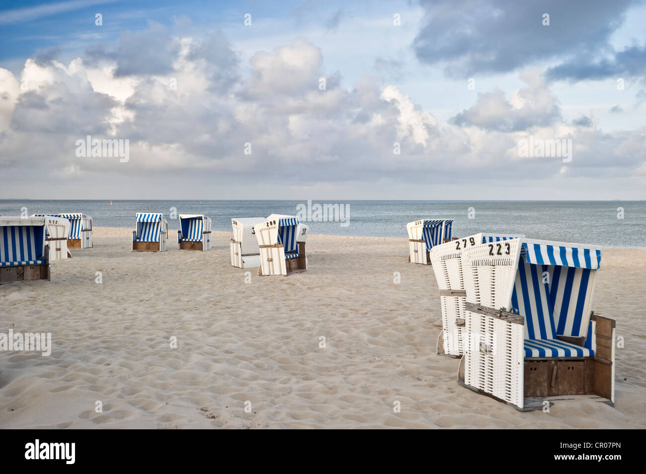 Covered wicker beach chairs on the beach, Hoernum, Sylt island