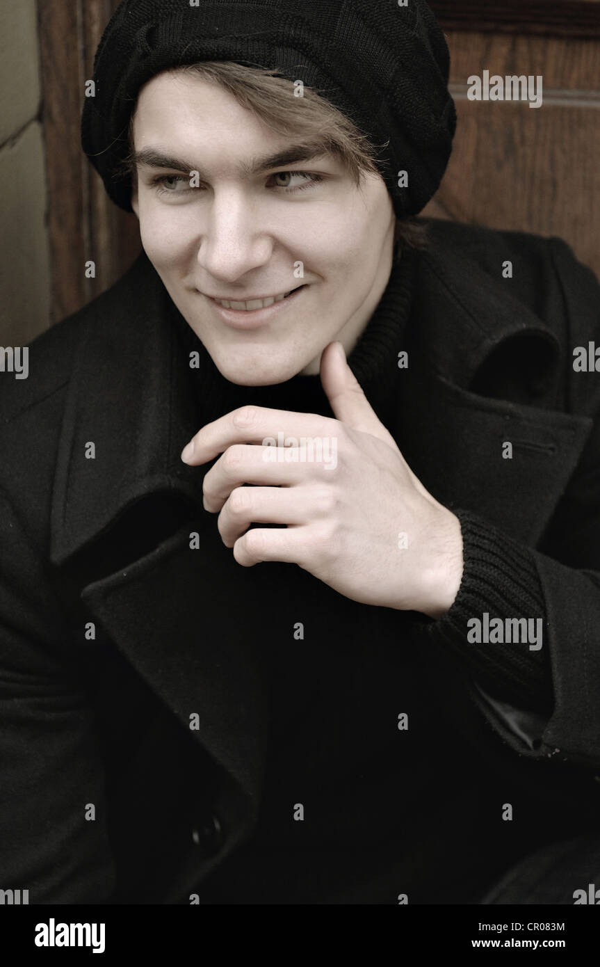 Young man wearing winter clothes, portrait Stock Photo - Alamy