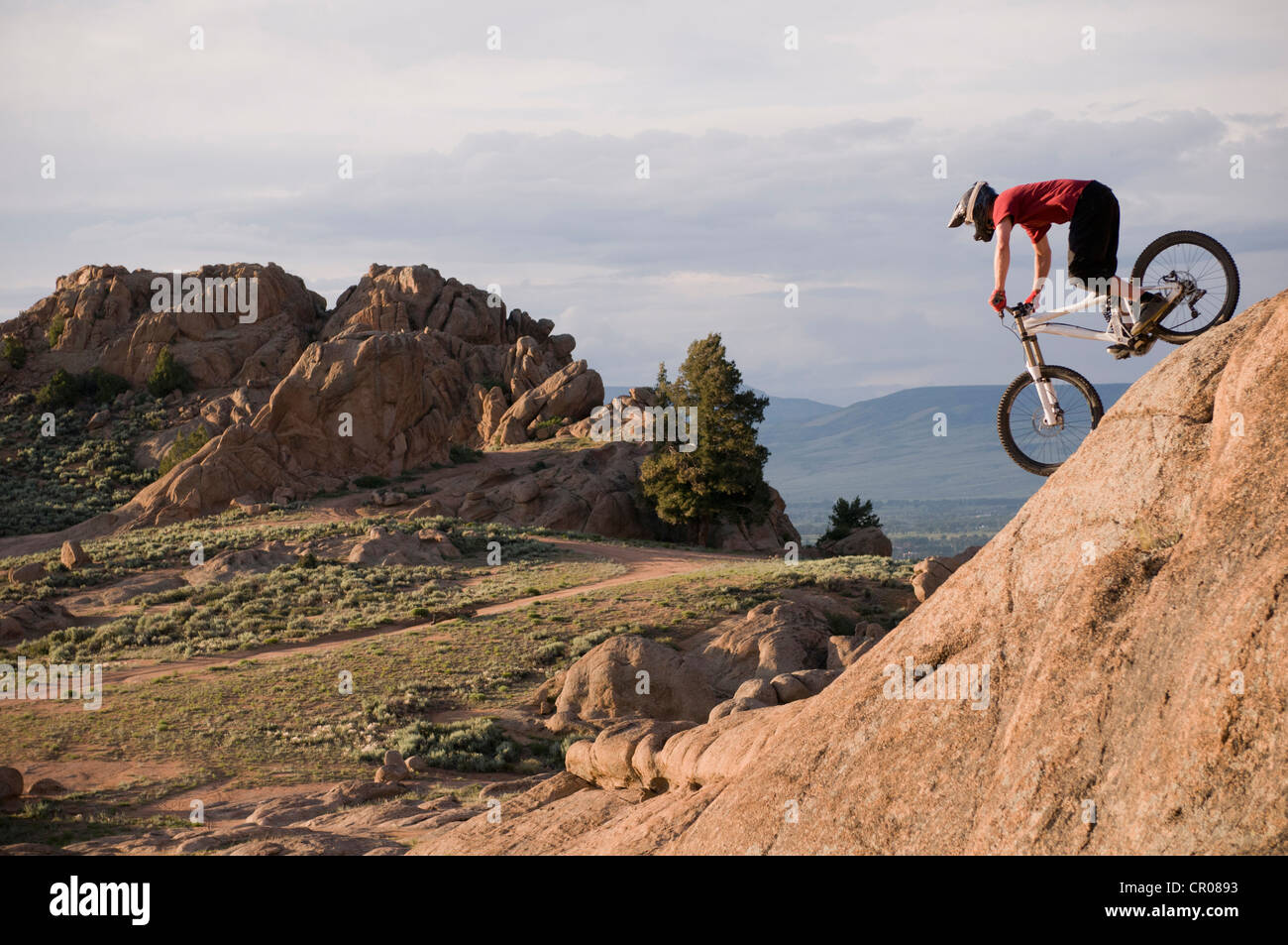Mountain biker on rock formations Stock Photo - Alamy