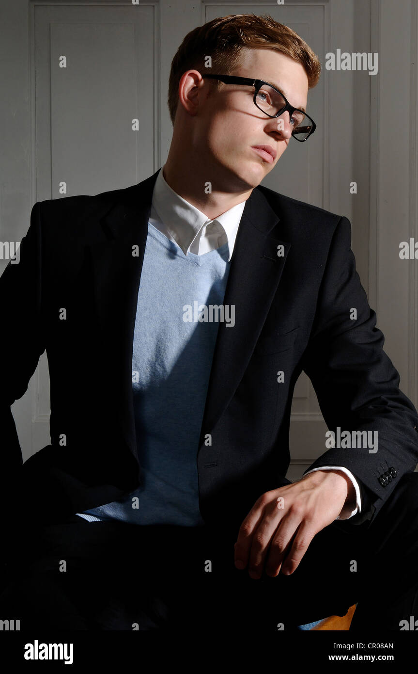 Young man wearing a suit and glasses Stock Photo - Alamy