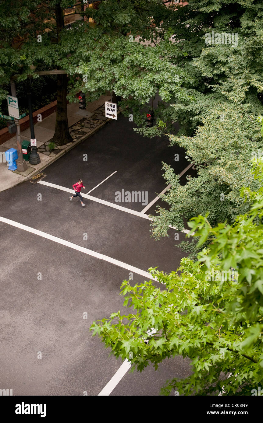 Overhead view of runner on city street Stock Photo - Alamy