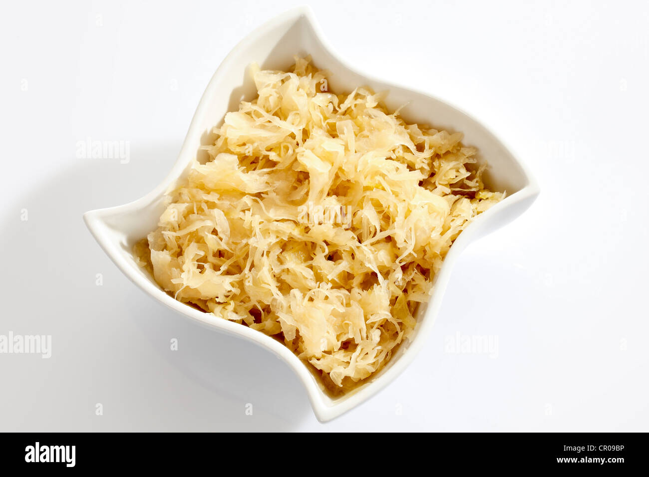 Sauerkraut from a can in a white porcelain bowl Stock Photo