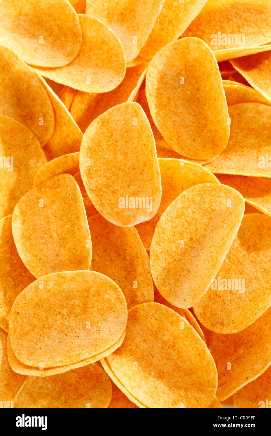 Oval paprika potato chips, stacking chips, fullframe Stock Photo Alamy