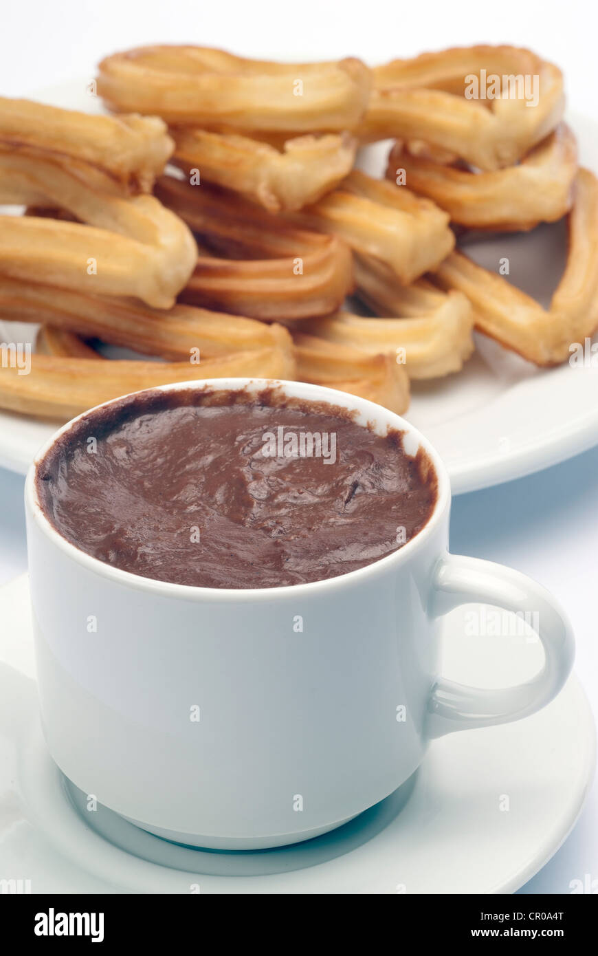 hot chocolate with churros on white background Stock Photo