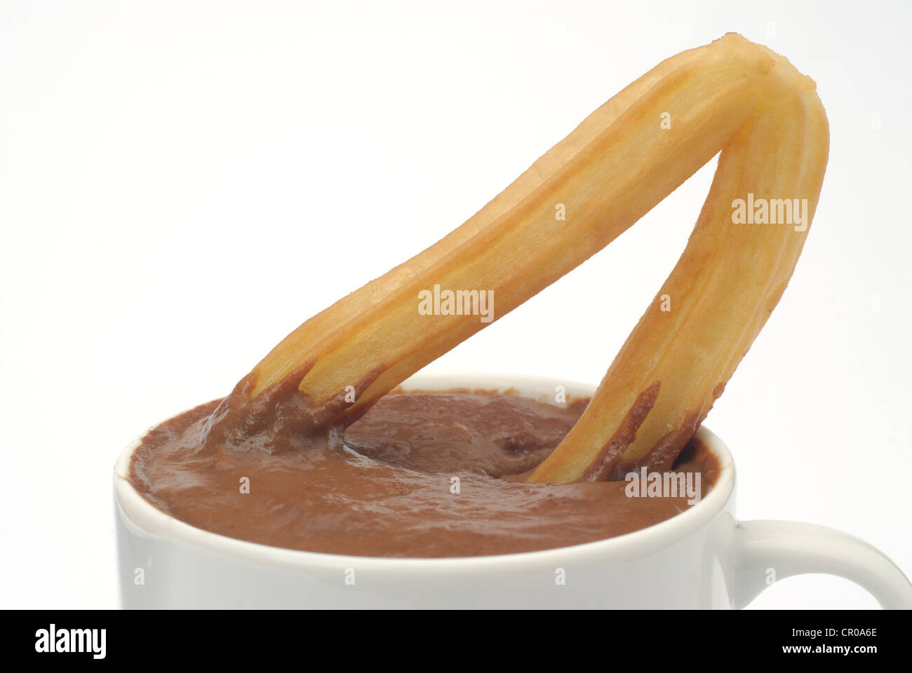 hot chocolate with churros on white background Stock Photo