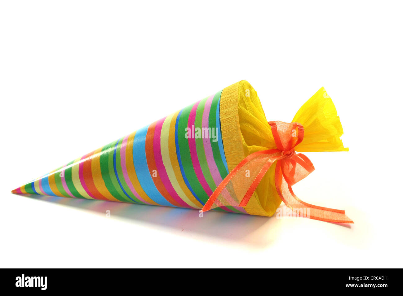 a colorful school cone filled with candy on a white background Stock Photo