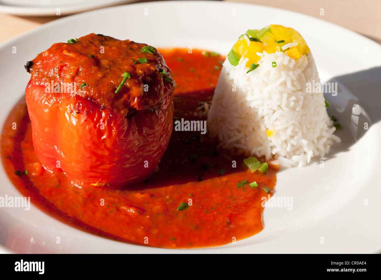 Red pepper stuffed with mincemeat, tomato sauce and rice Stock Photo