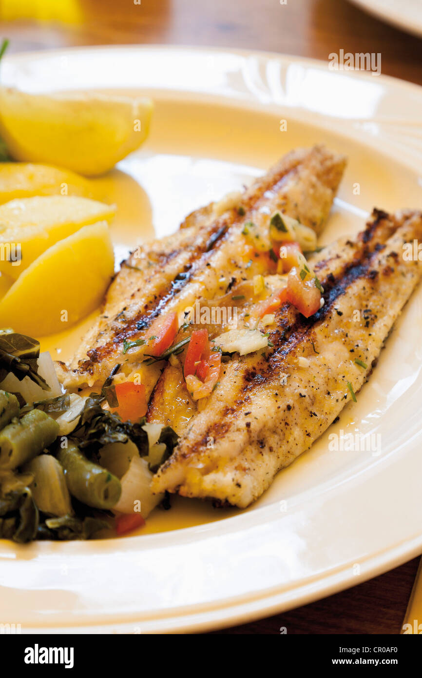Grilled sea bass with green beans and boiled potatoes Stock Photo Alamy
