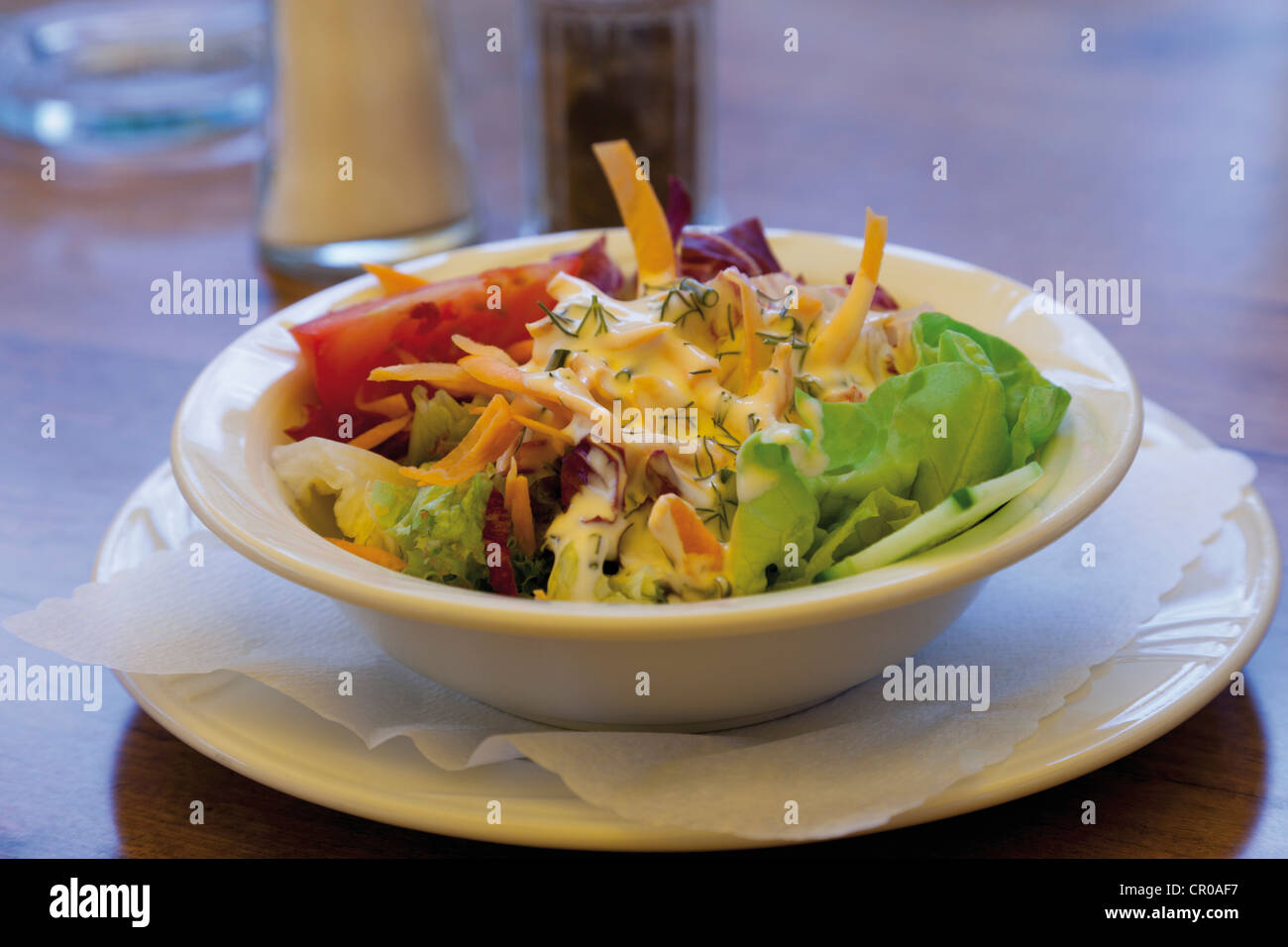 Mixed salad with vinaigrette and yoghurt dressing Stock Photo