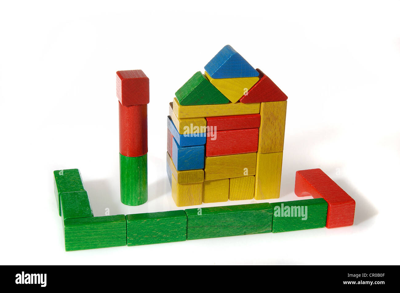 Colourful building blocks assembled in the shape of a house Stock Photo