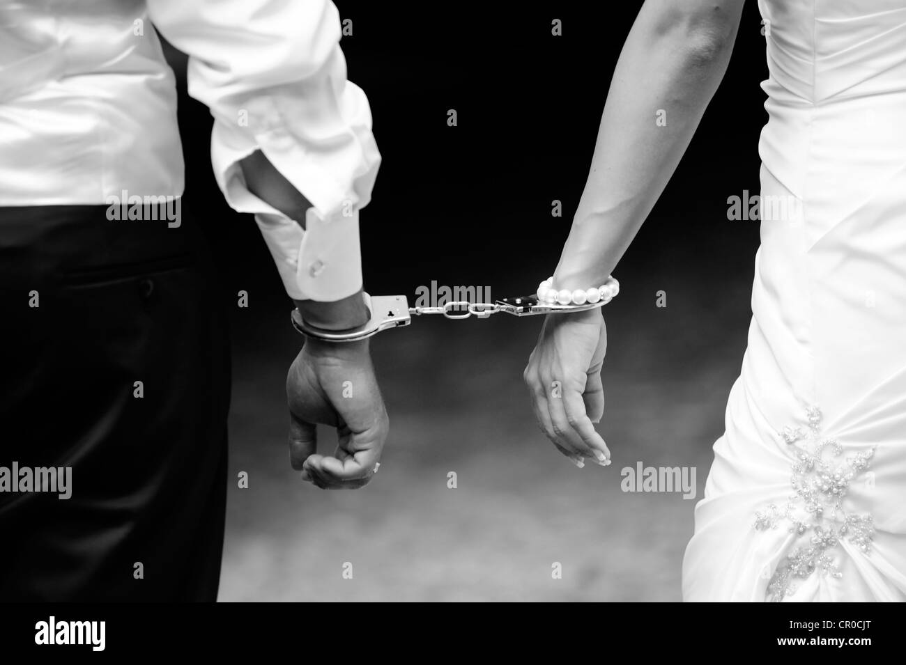 Wedding, bride and groom with handcuffs Stock Photo Alamy