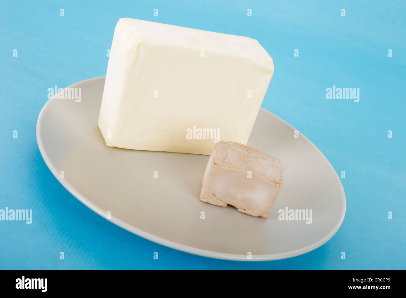 Butter and yeast on a plate Stock Photo Alamy