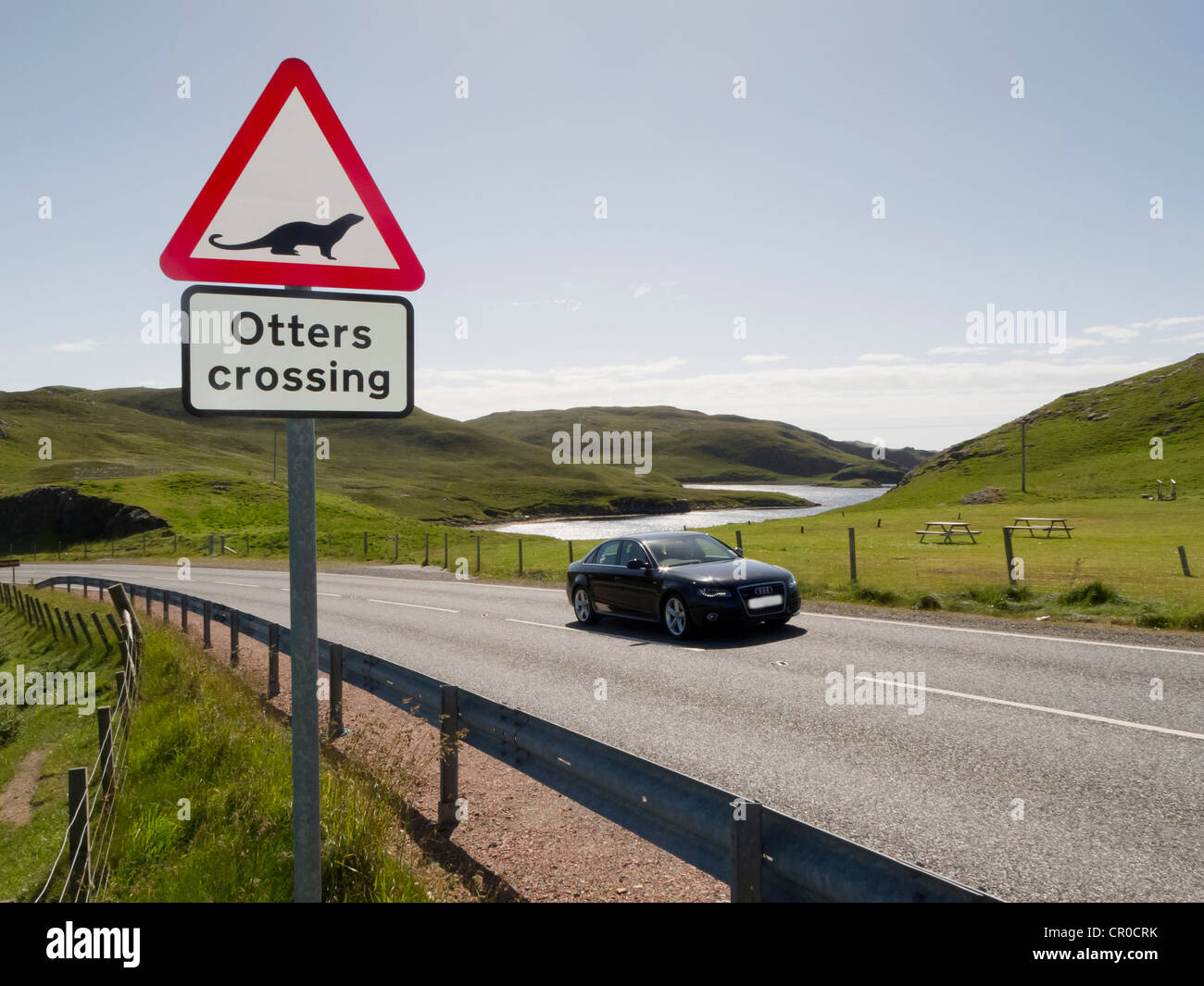 'Otters crossing' warning road sign at Mavis Grind, Shetland Islands. June 2010. Stock Photo