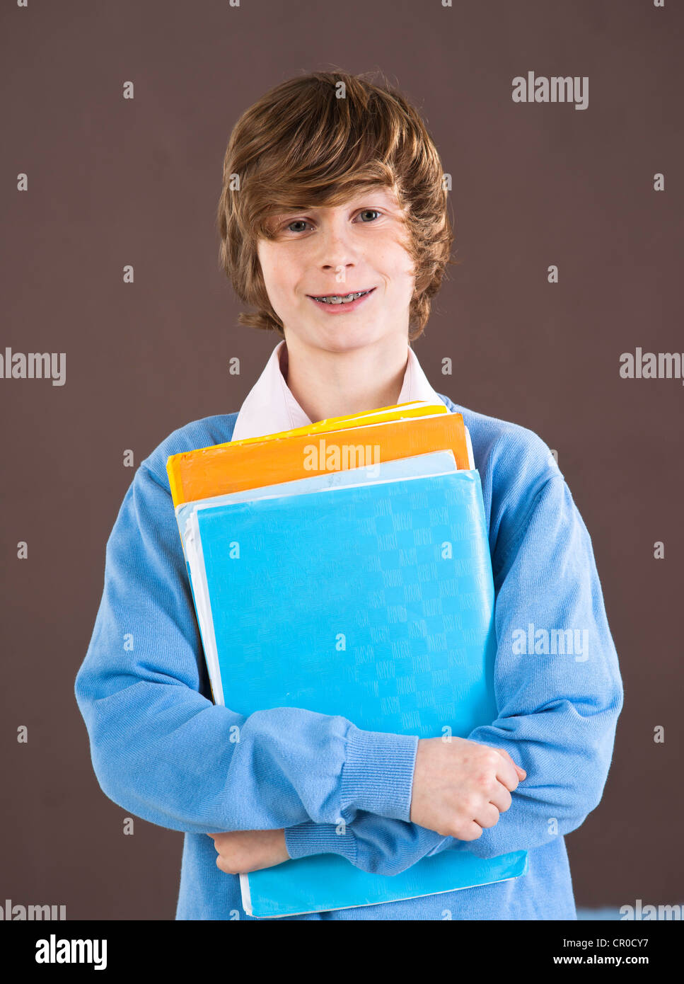 Boy holding school books Stock Photo