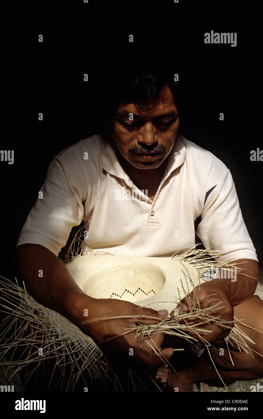 Mexico, Yucatan State, Becal, artisan of Panamas hats weaving in a cave ...