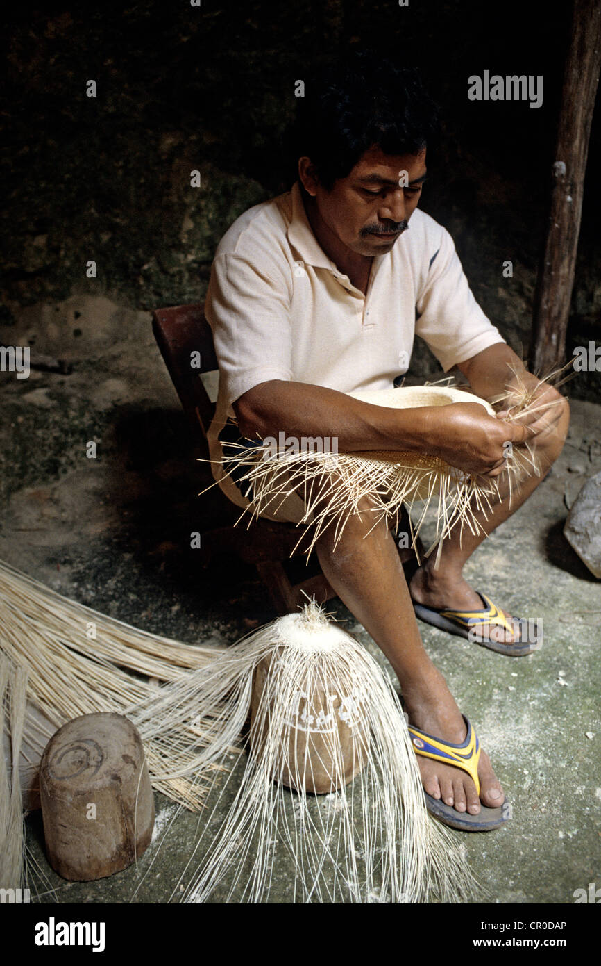 Mexico, Yucatan State, Becal, artisan of Panamas hats weaving in a cave ...