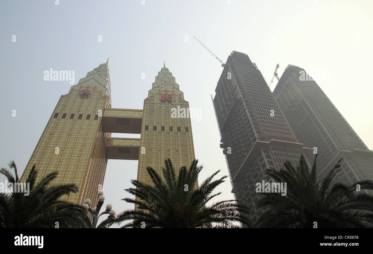 The Sheraton towers and two buildings under construction in Chongqing Stock Photo