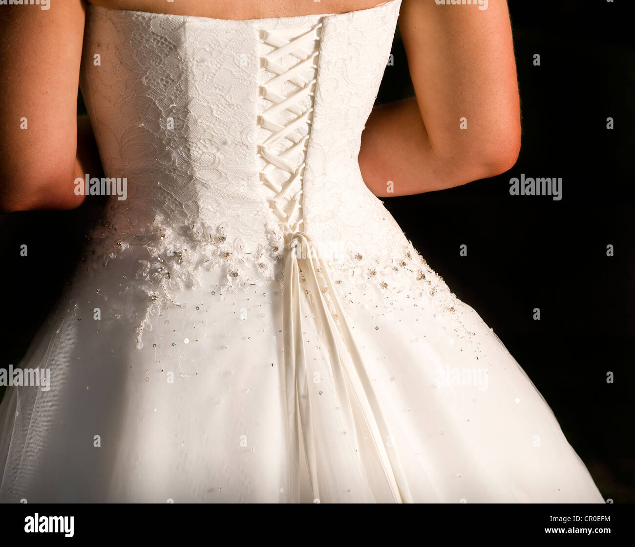 Back Of Brides Ivory Cream Wedding Dress With Corset Laced Back