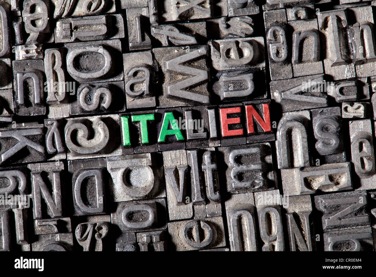 Old lead type forming the word 'Italien', German for 'Italy', in national colors Stock Photo