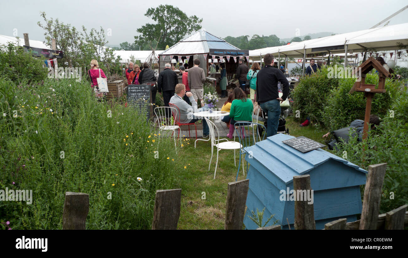 People relaxing in the Wiggly garden Hay Festival Hay on Wye Wales UK