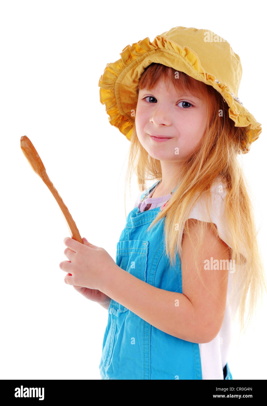 Small beauty girl with big wooden spoon on white background Stock Photo