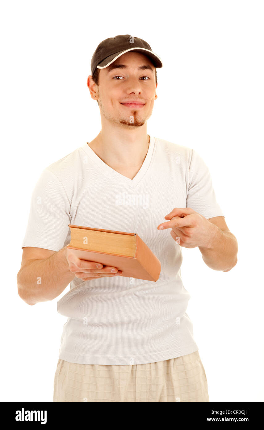 Smiling young casual men show a book by finger isolated on white background. Stock Photo