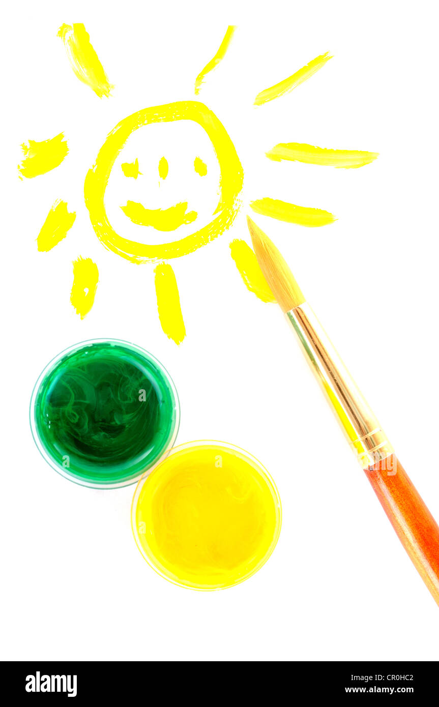 Smiling sun, paint and small brush on white background Stock Photo