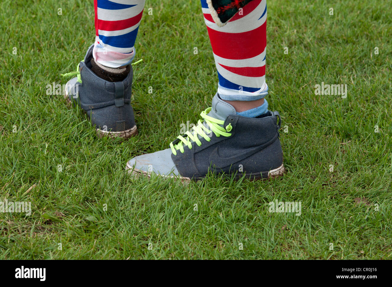 Girl wearing Union Jack trousers and Nike boots Stock Photo - Alamy